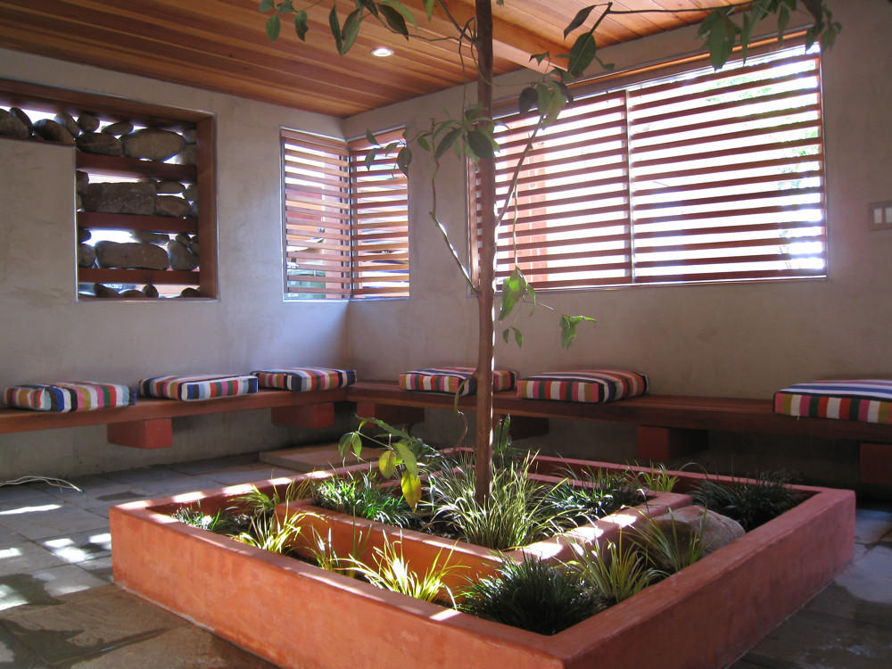 Home interior mid-remodel with exposed framing, new drywall, and construction materials staged in a Los Angeles house