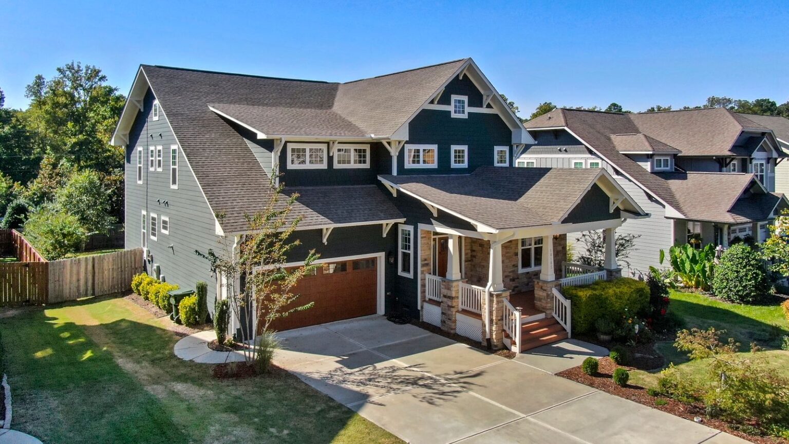 Craftsman house exterior with a gabled porch and wood detail