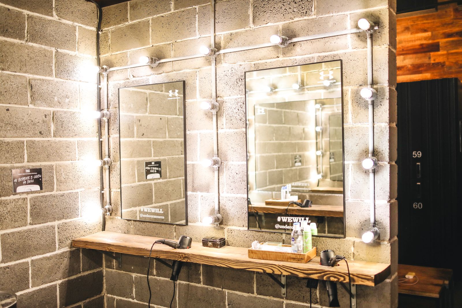 Vanity mirrors framed by rows of round light bulbs