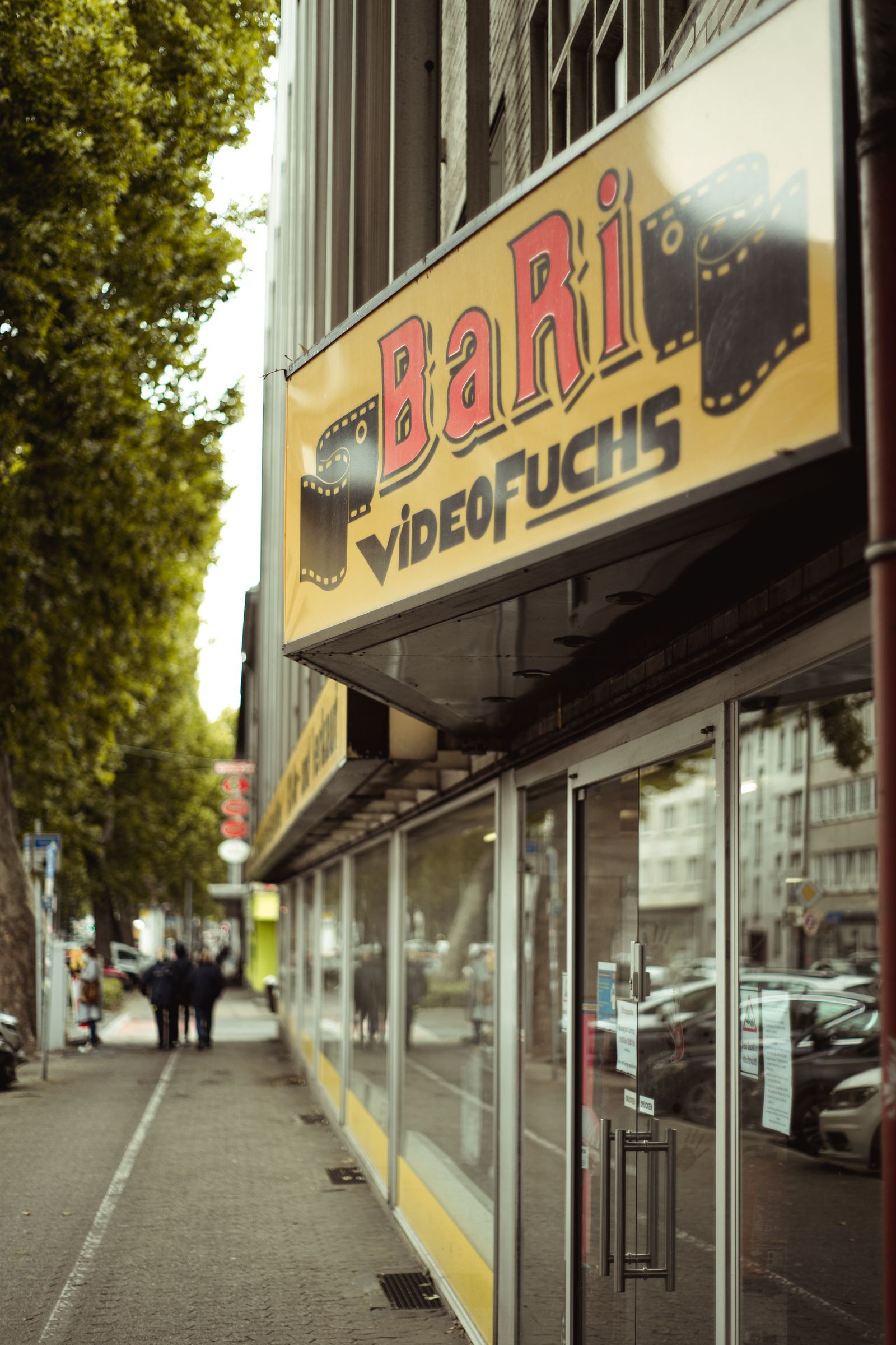 Shop front with a large glass window facing a city sidewalk