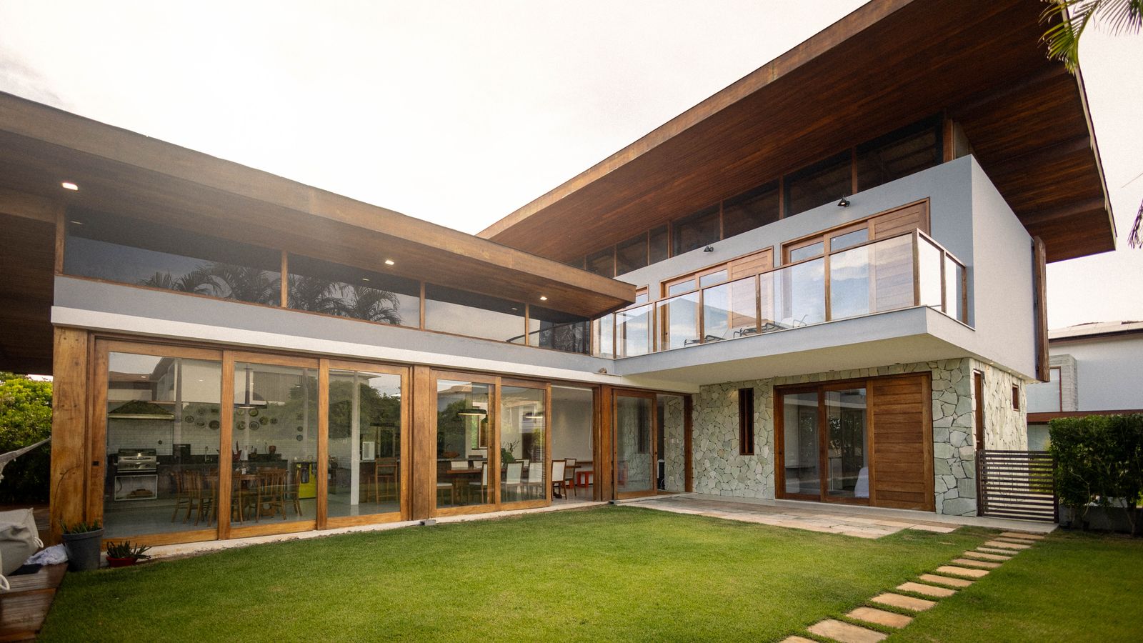 Modern house with large glass windows and a wood-clad exterior