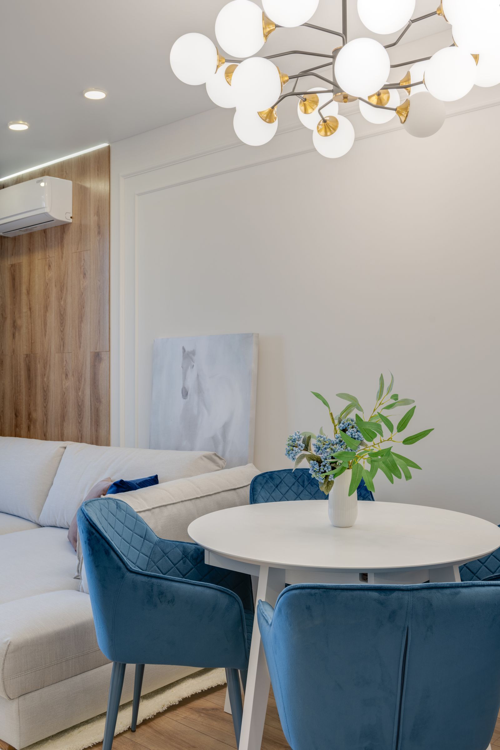 Sofa, low table and chairs arranged in a showroom-style setting